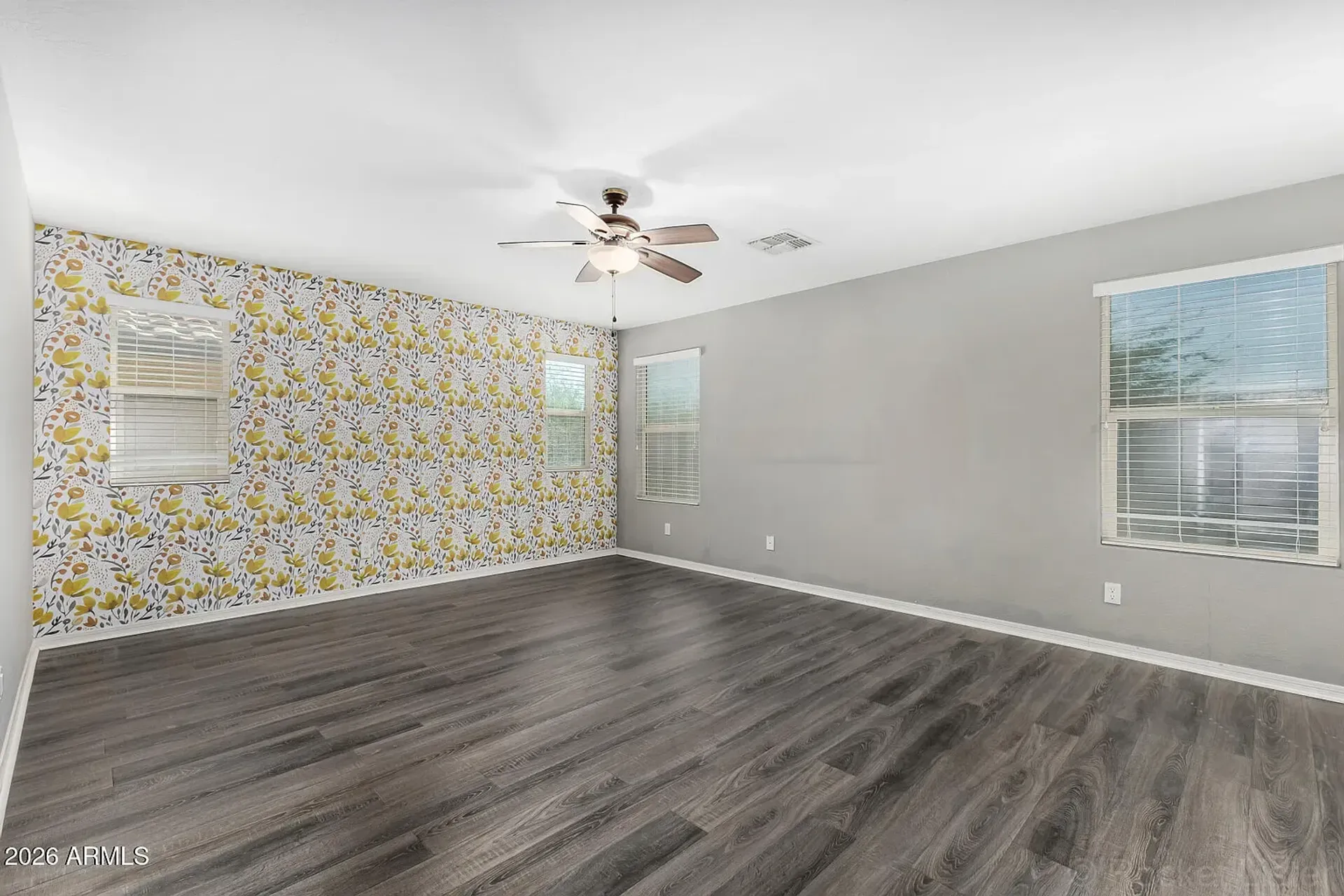 Finished wallpaper accent wall installation in a Mesa master bedroom