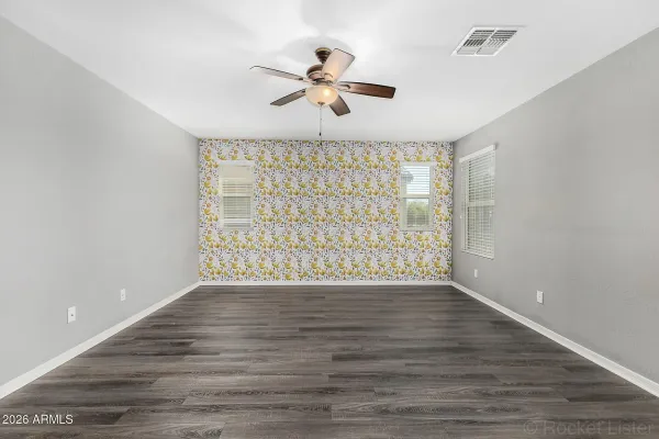 Wallpaper accent wall after installation in a Mesa master bedroom