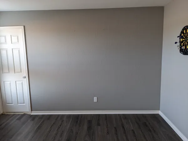 Office den wall before custom bookshelf built-in in Mesa