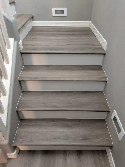 Finished LVP stair installation with custom bullnose detail in Mesa