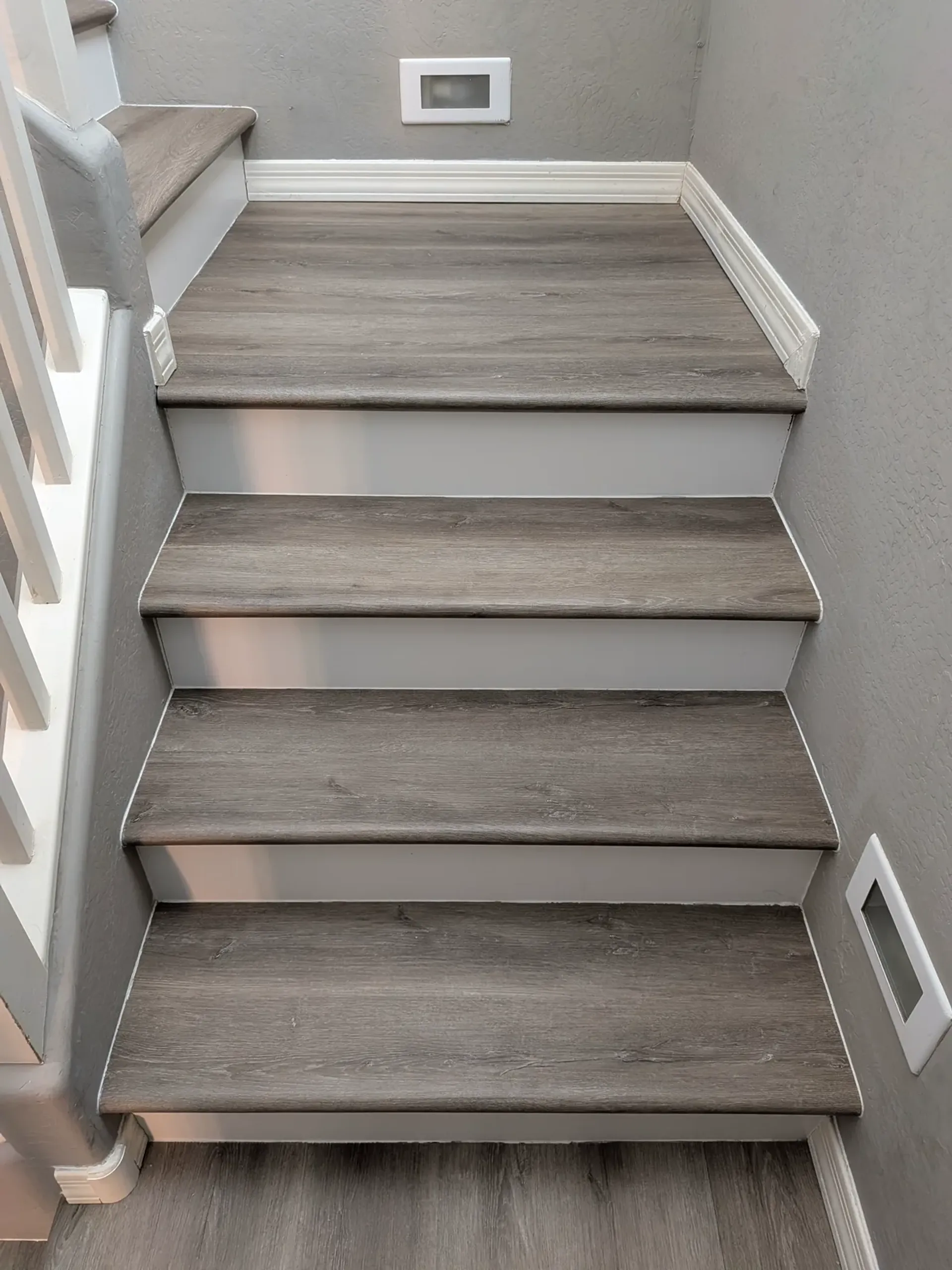 Finished LVP stair installation with custom bullnose detail in Mesa