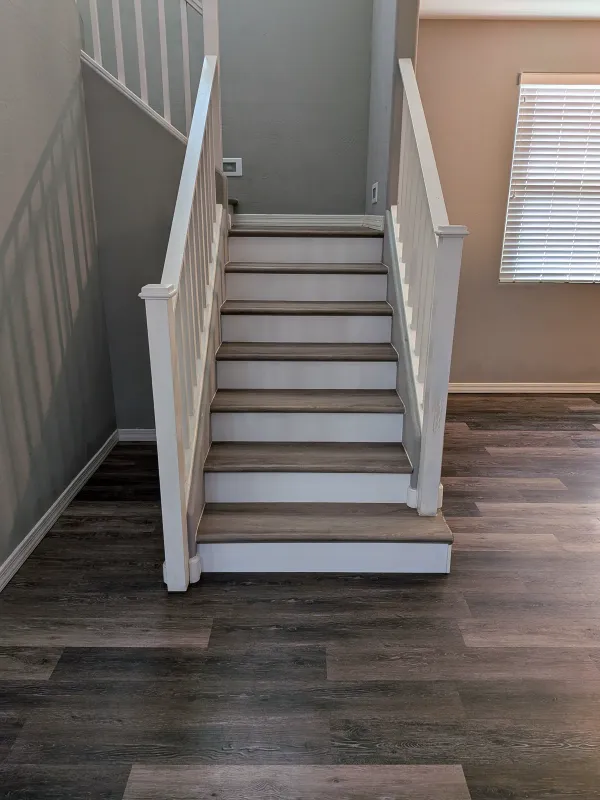 Clean LVP stair transition and platform detail in Mesa