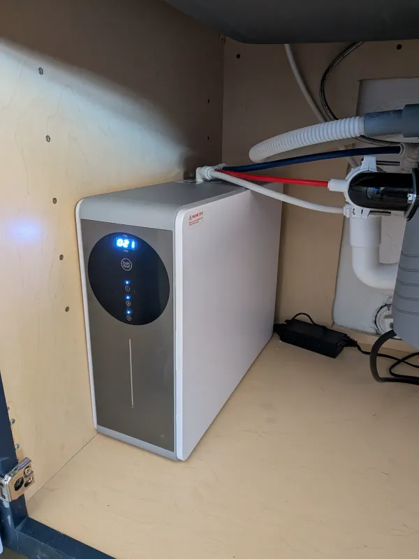 Close view of the reverse osmosis system installed under a Gilbert kitchen sink
