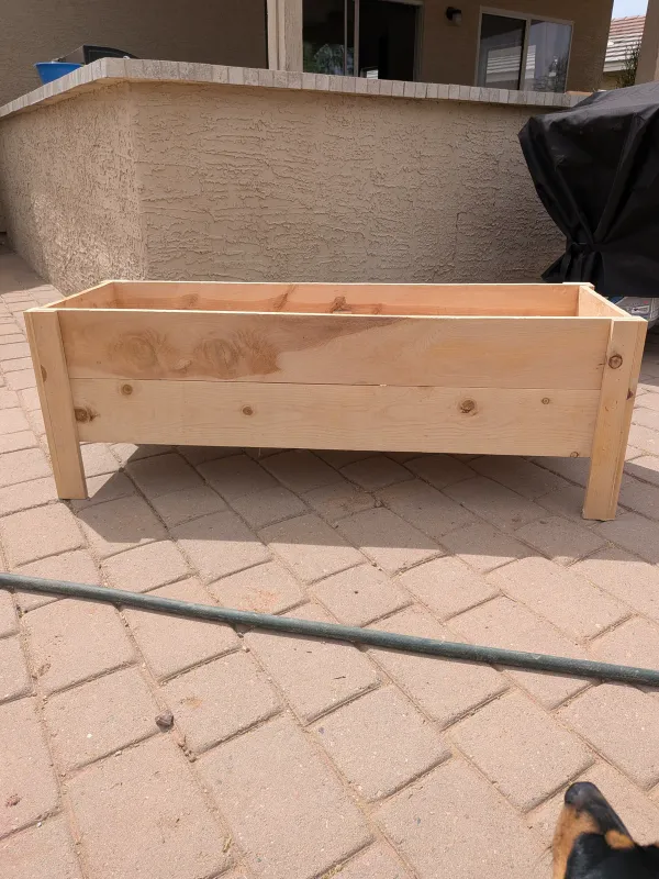 Custom outdoor cedar planter bed with drainage before plants in Gilbert
