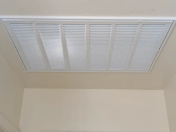 Caulked return air grille edge after installation