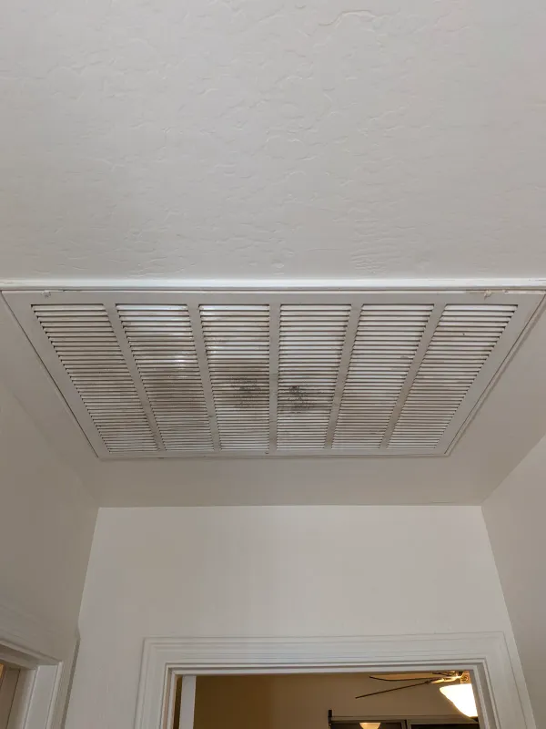 Old ceiling return air grille before replacement in Gilbert