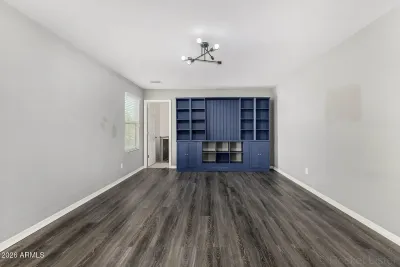 Finished custom bookshelf built-in with lower cabinet storage in Mesa